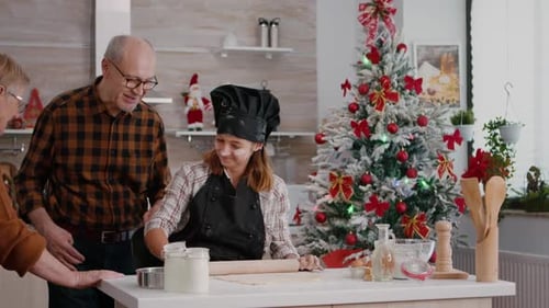 Family Baking Cookies in Festive Holiday Kitchen