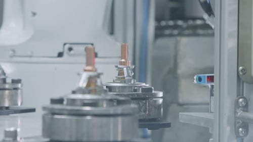 Advanced robotic machine manufacturing parts in an automated assembly line