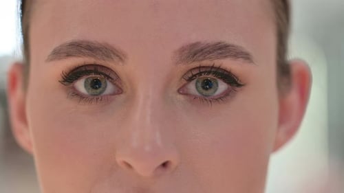 Close Up of Blinking Eyes of Young Woman