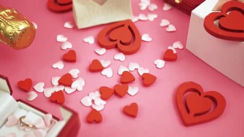 Romantic Hearts and Ring on Pink Background
