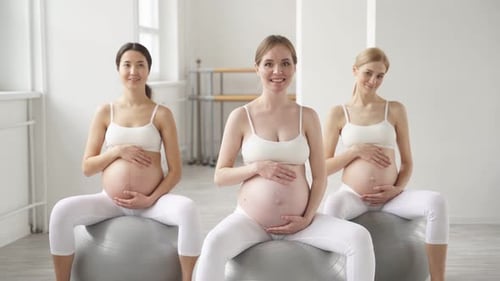 Pregnant Women Sitting on Exercise Balls