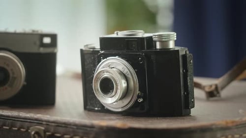 Close up of vintage camera on old suitcase