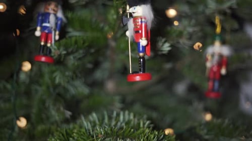 Decoration Toy Nutcracker on Christmas Tree. 4K Dolly Shot.