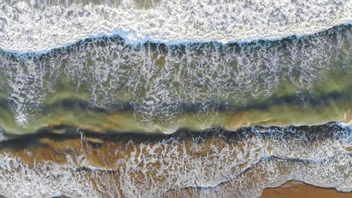 Waves Crashing on Beach from Birds Eye View