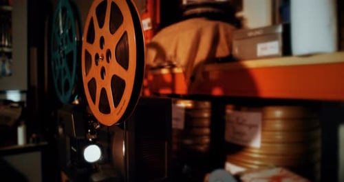 Vintage Film Projector With Spinning Reels and Light