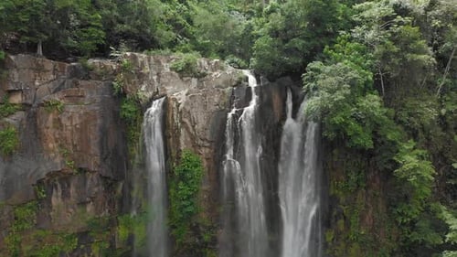 Aerial of beautiful waterfall in the jungle of costa rica