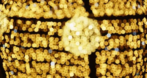 Golden Bokeh Lights Shimmering Abstract Background