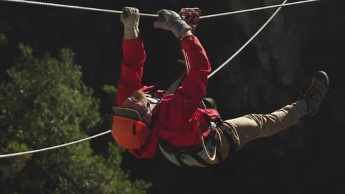 Young Caucasian man zip lining