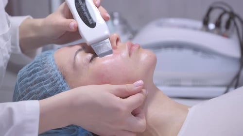 Woman Receiving Facial Treatment at Medical Spa