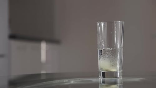 Effervescent Tablet Dissolving in a Glass of Water