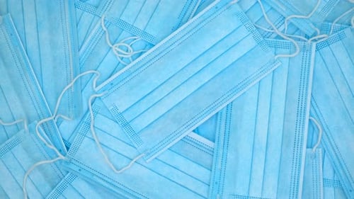 Close Up of Stacked Disposable Surgical Masks