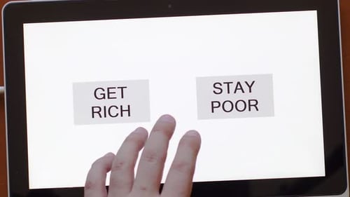 Close-up of a man's hand between the RICH and POOR buttons