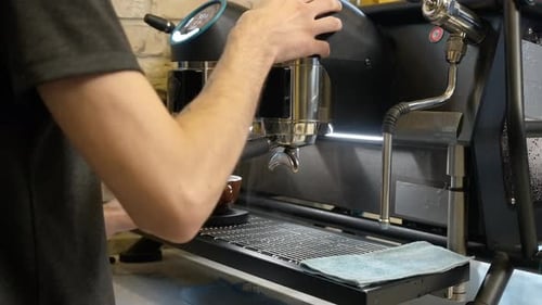 Barista Brewing Espresso with a Modern Machine