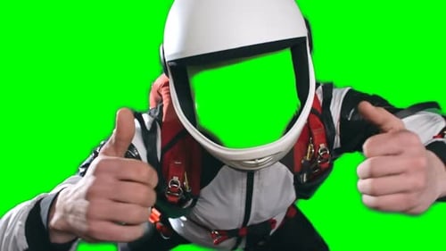 Helmeted Figure in Suit with Thumbs Up on Greenscreen