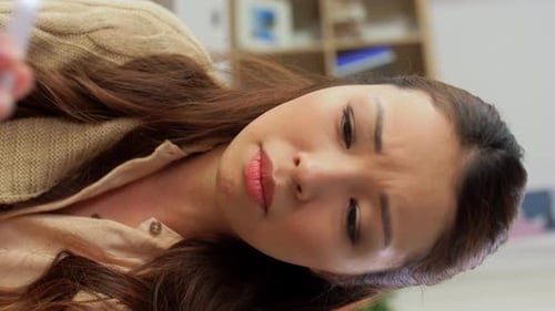 Sick Woman Checking Temperature with Thermometer