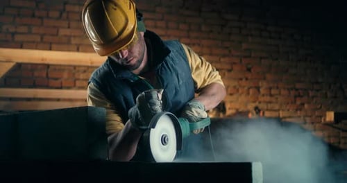 Adult Man Cutting Brick Wall