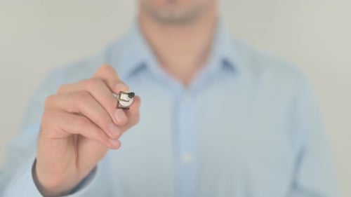 Man Writes Expertise on Clear Surface