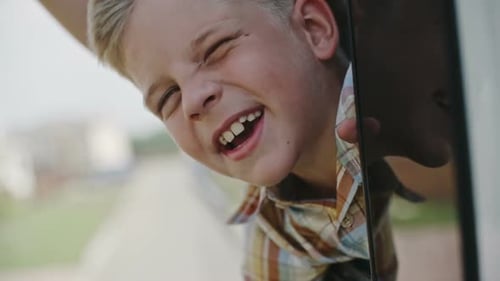 Happy Boy Traveling by Car