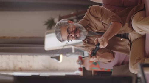 Excited Adult Man Playing Video Game at Home