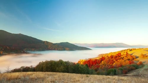 Foggy Mountain Range During a Golden Sunrise