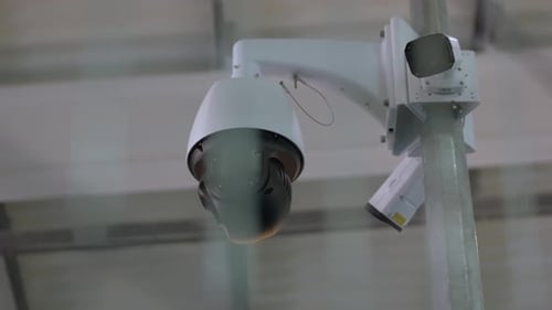 Black Surveillance Video Camera Turning to the Right