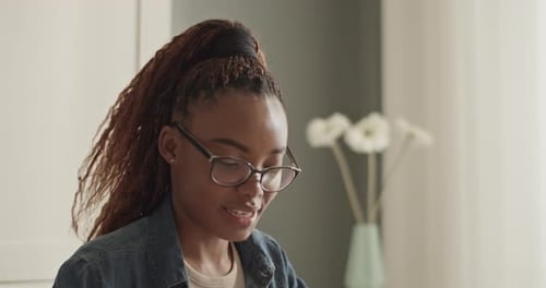 Young Woman Talking At Home With Tablet