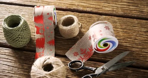 Holiday craft supplies on a wooden table