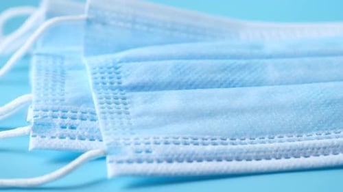 Close Up of Blue Surgical Masks on Table