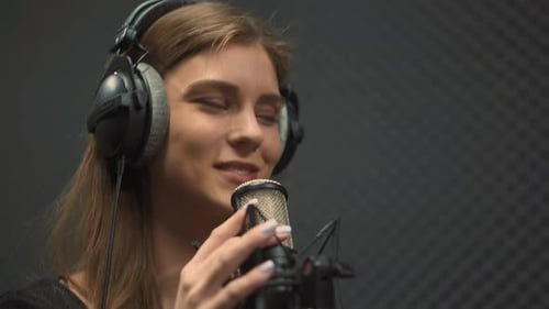 Talented Singer Records Hit with Microphone in Audio Studio
