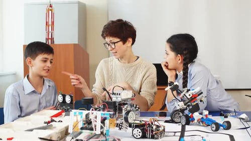 Students Building Robots Together in Classroom Setting