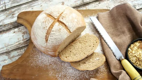Artisanal Sourdough Bread on Wooden Cutting Board