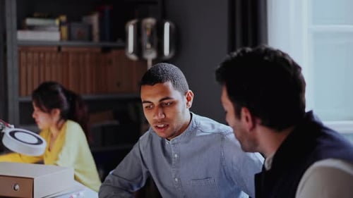 Two businessmen working in a creative office