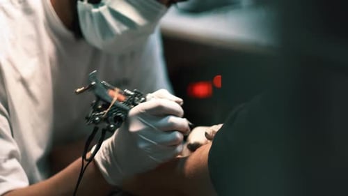 Tattoo Artist Applying Tattoo Close Up