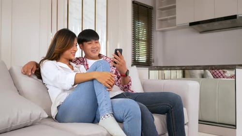 Couple Relaxing on Couch Together