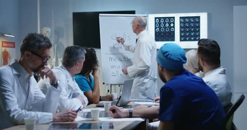 Medical Professionals Attend Presentation in Conference Room
