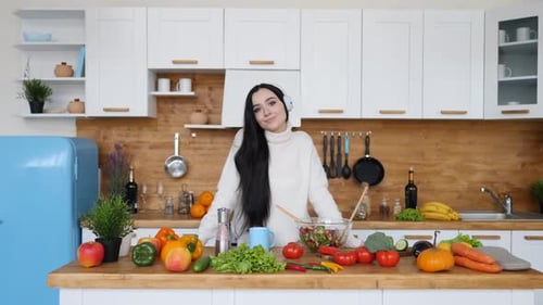 Smiling Woman with Vegetables in Bright Kitchen