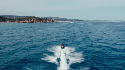 Jet Ski Cruising on Open Ocean Water