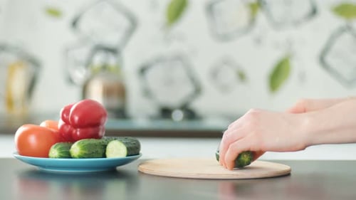 Slicing Fresh Cucumber in Bright Kitchen