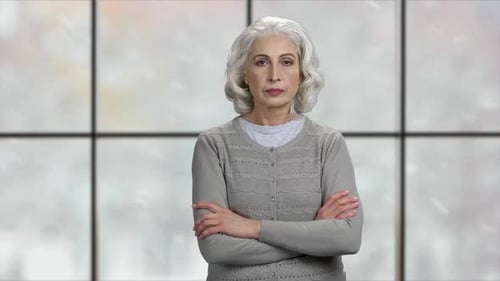 Mature Woman Showing Silence Gesture