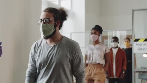 Office Workers in Face Masks Getting Contactless Temperature Check Up