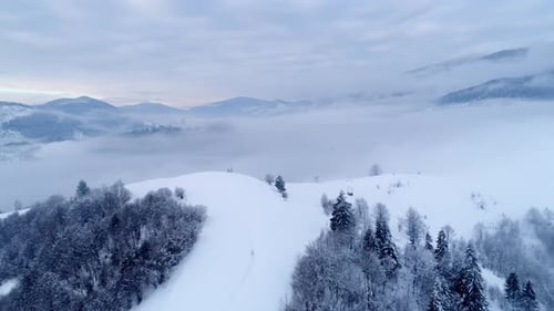 Aerial View in Foggy Sunset Winter Mountain