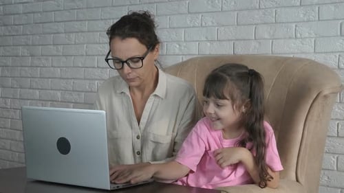 Mom Works at Home on the Computer