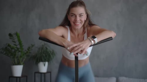 Woman Exercising on Mini Trampoline at Home
