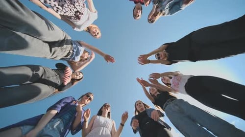 Group of Young Women Puts Hands Together