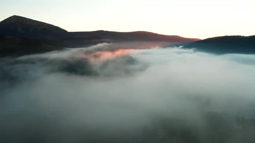 Aerial View of Foggy Sunrise in the Mountains