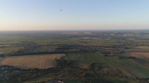 Peaceful Aerial View of Fields and Rural Landscape