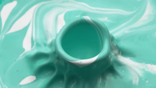 Paint bouncing and making splashes. Slow Motion. Unedited version is included at the end of clip.