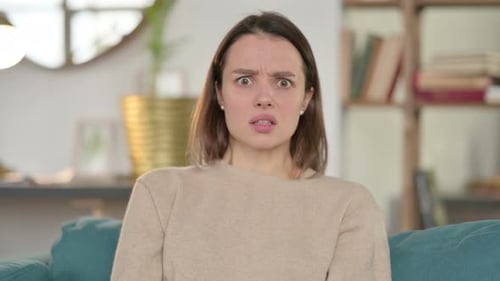 Surprised Young Woman with Shocked Expression