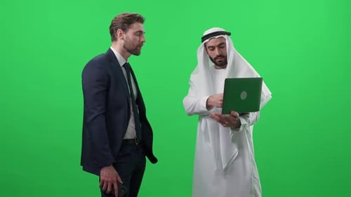 Business Meeting Using Laptop in Green Screen Studio