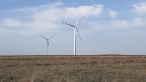 Work of the Group of Wind Power. Wind Power Generator Installed in the Field.